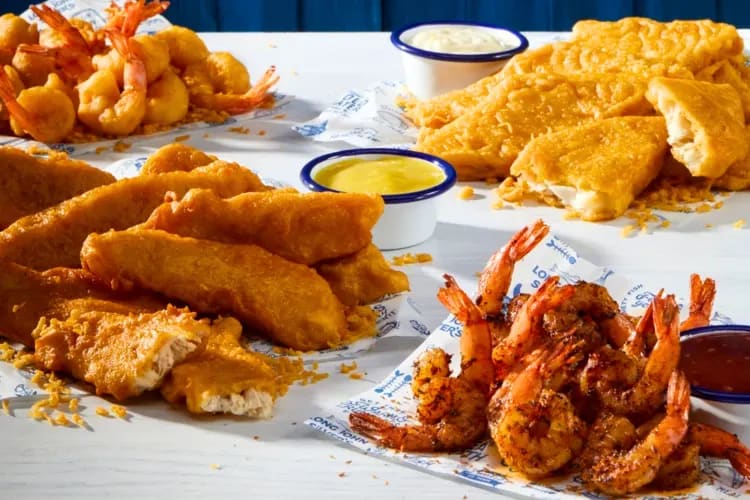 Battered fish and seafood dishes on a table