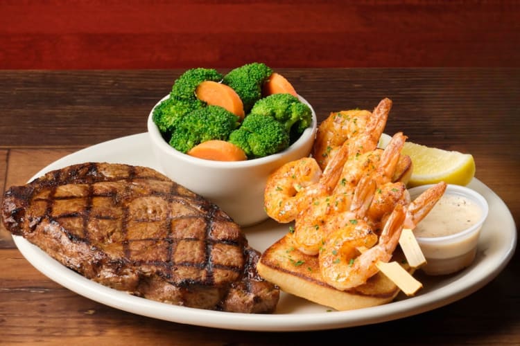 Steak, grilled shrimp and vegetables