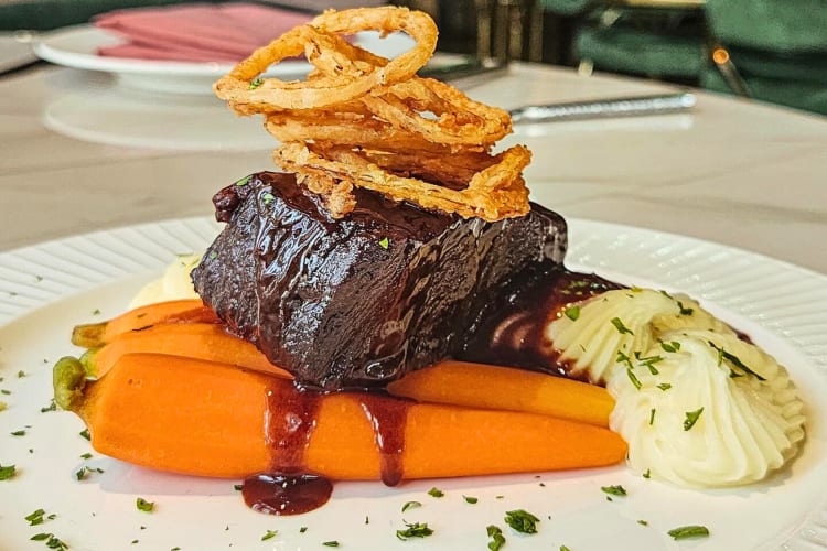 Braised beef short rib, baby carrots, yukon gold mashed potatoes and frizzled onions from Sexy Steak