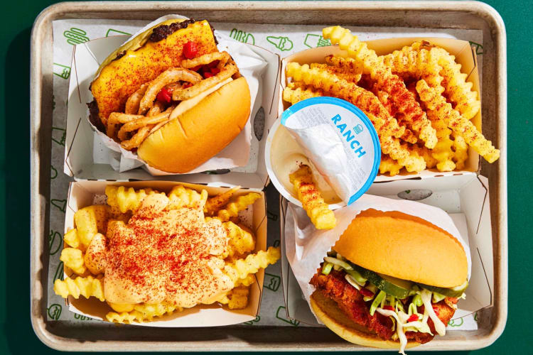 Burgers and crinkle cut fries on a tray 