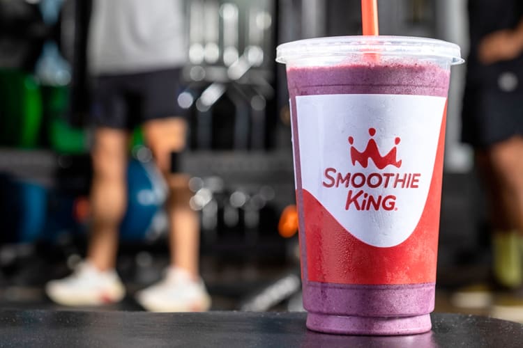 A purple smoothie in a gym