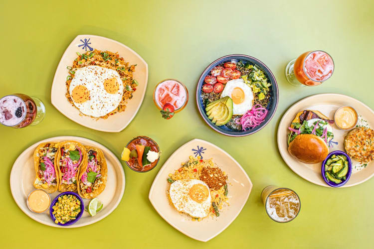 Aerial shot of a variety of breakfast meals from Snooze, an A.M. Eatery