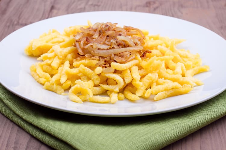 Spaetzle, a German Christmas food, topped with fried onion