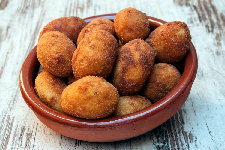 A bowl of fried Spanish croquetas 