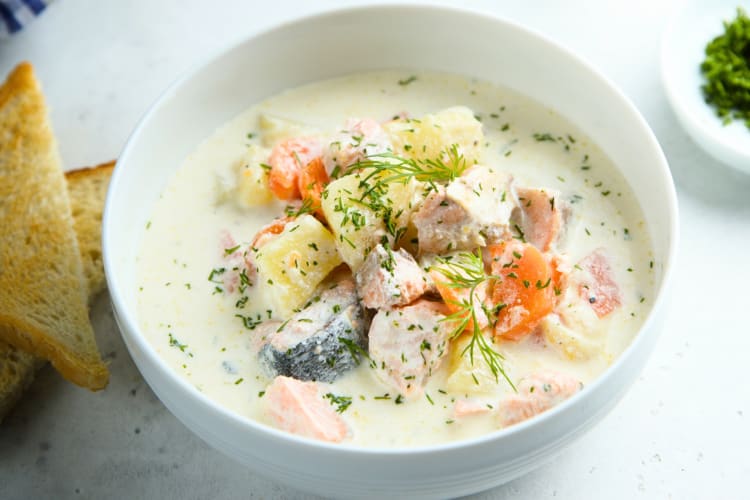 A bowl of chowder with mixed fish