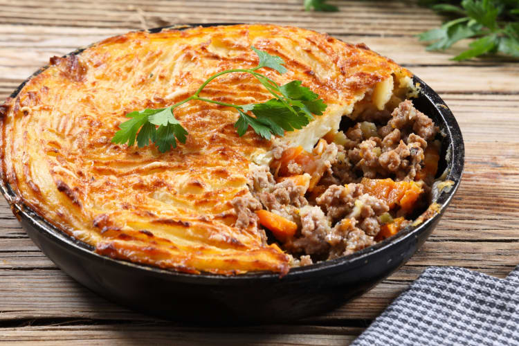 A pie with meat filling and a potato topping