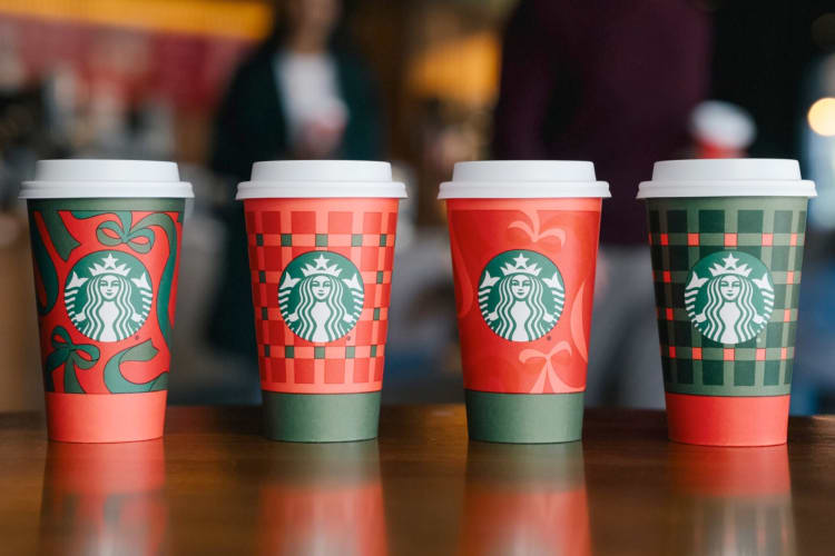 Starbucks holiday drink cups in red and green patterns