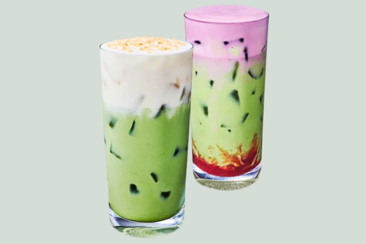 Two iced matcha drinks with flavored foam from Starbucks