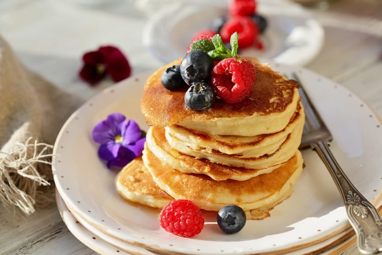 Buttermilk pancakes with raspberries and blueberries on top