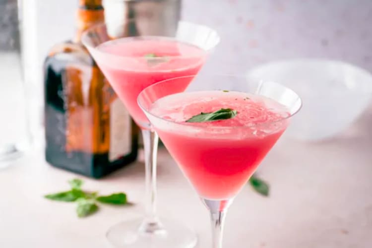 Sipping pineapple margaritas while planning a vacation is a fun stay-home date idea 