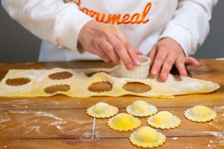 Making dinner from scratch, like stuffed pasta, is a fun stay home date idea