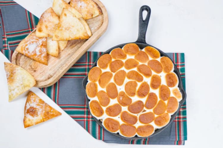 Making s'mores dip is a fun stay home date idea