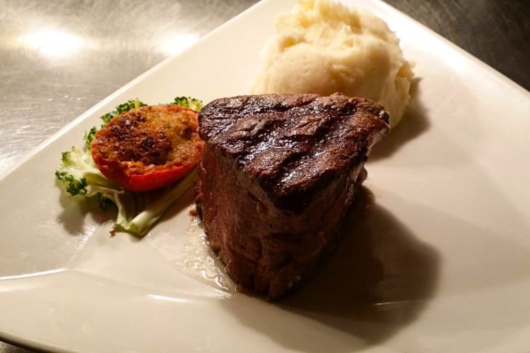 Steak meal with a side salad and mashed potato, from Stonewood Grill & Tavern