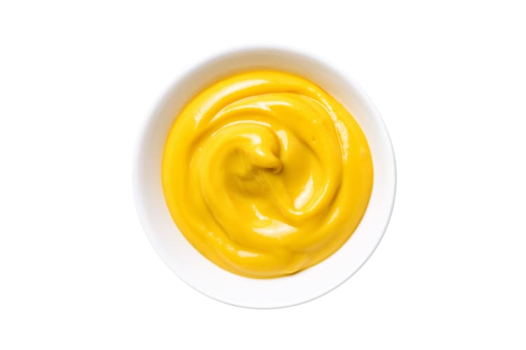 A white ramekin of mustard