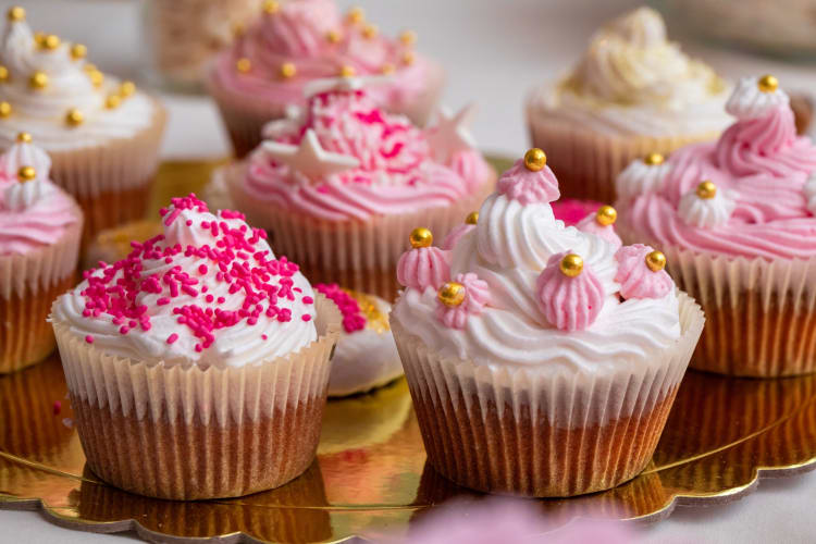 Decorating cupcakes is a fun summer birthday party idea for kids