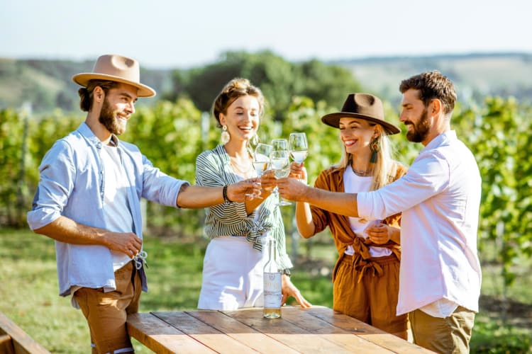 People drinking wine at a winery