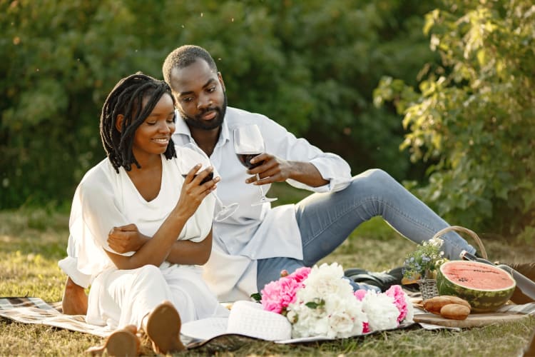 A couple having a picnic on the grass