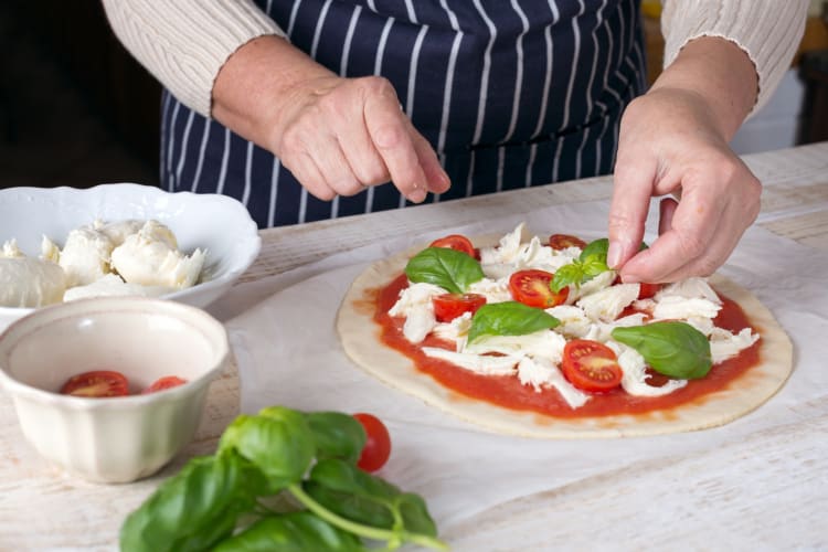 A person making a pizza