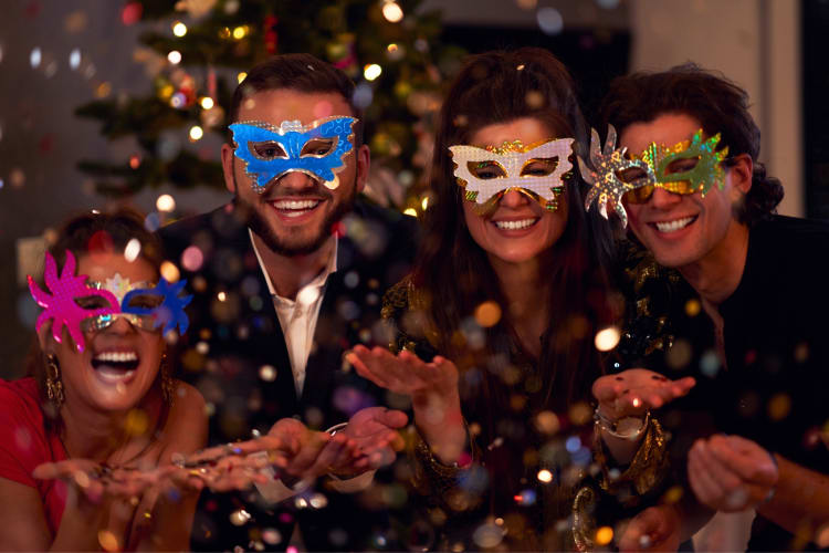People wearing masks at a masquerade party