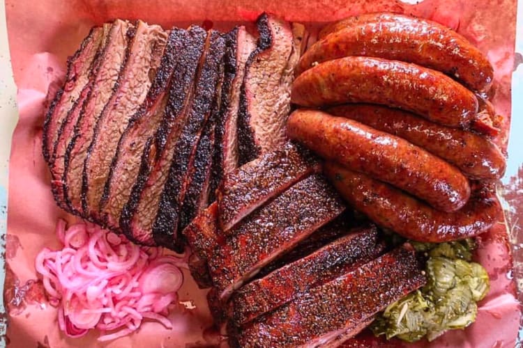 Aerial view of a variety of meats from TRUTH BBQ, a restaurant in Houston