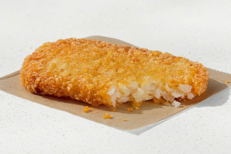 A hash brown with a bite taken out of it