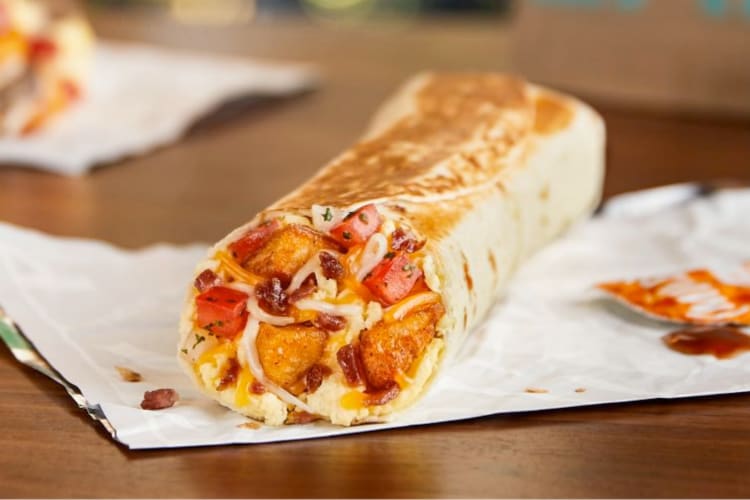 A Taco Bell breakfast burrito with eggs, potatoes and salsa