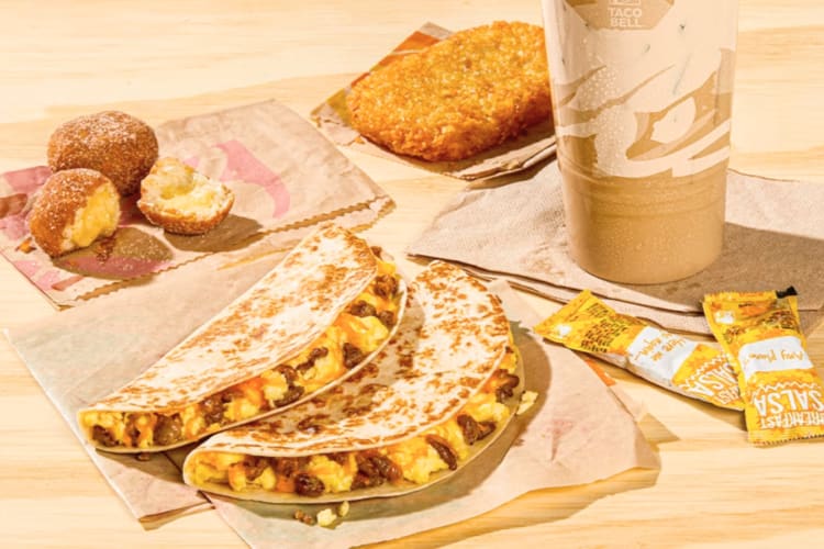 Taco Bell breakfast quesadilla, hash browns, Cinnabon Delights and Cinnabon coffee