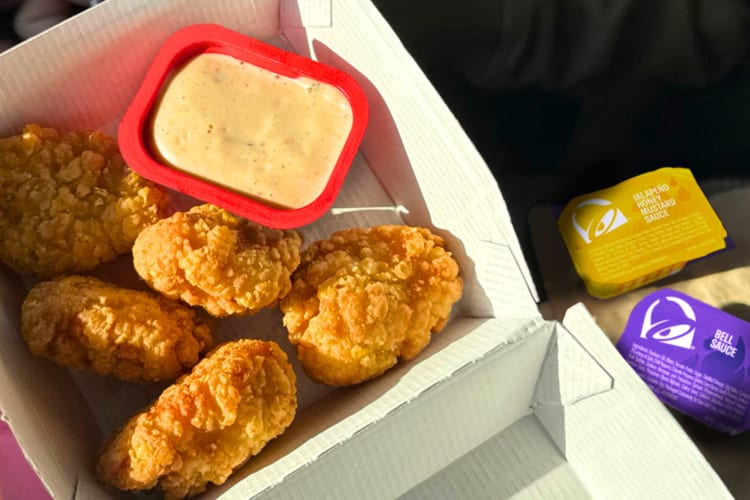 Chicken nuggets next to Taco Bell sauces