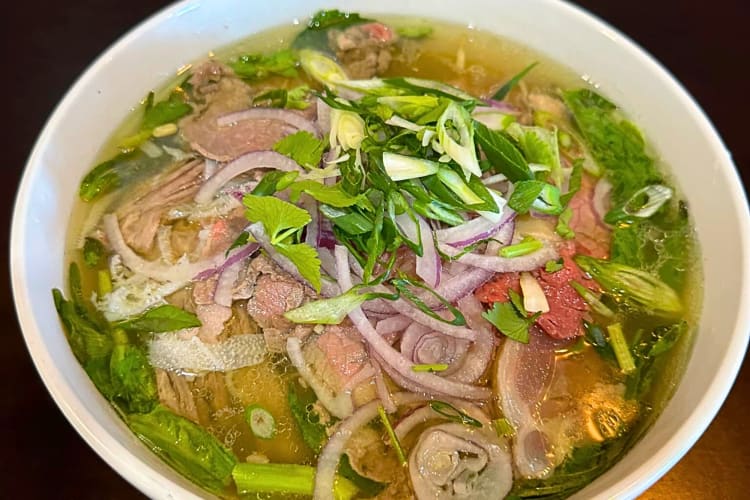Close-up view of a bowl of pho from Tada’s Kitchen