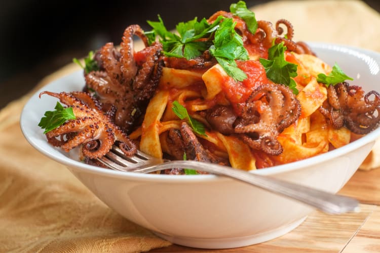 Bowl of Tagliatelle pasta with seafood on top