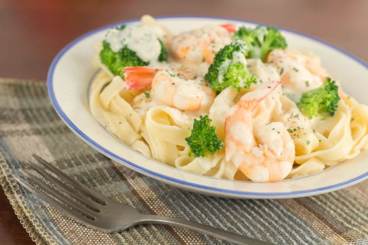 Fettuccine pasta dish with broccoli on top 