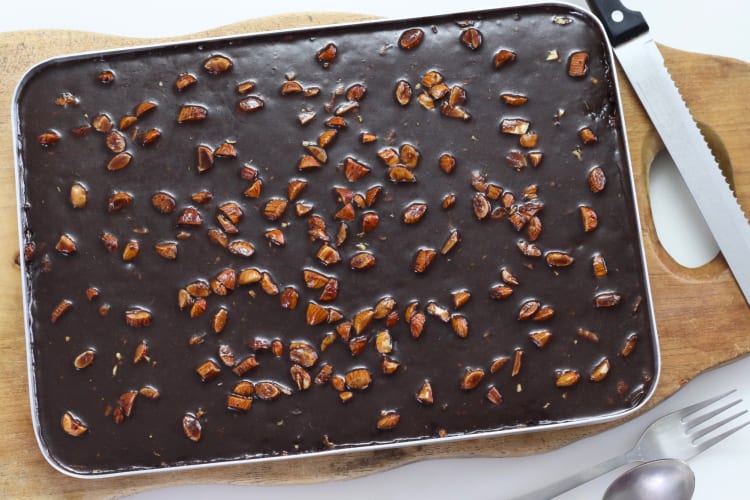 A chocolate sheet cake with pecans
