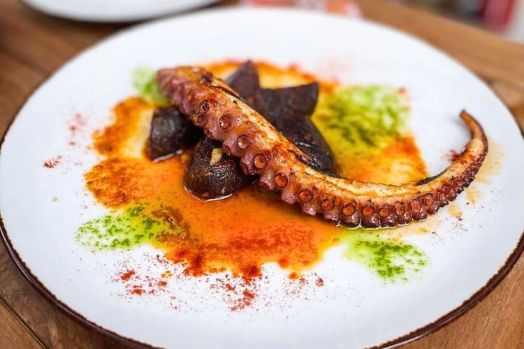 Grilled octopus meal from Tasca, a restaurant with private rooms in NYC