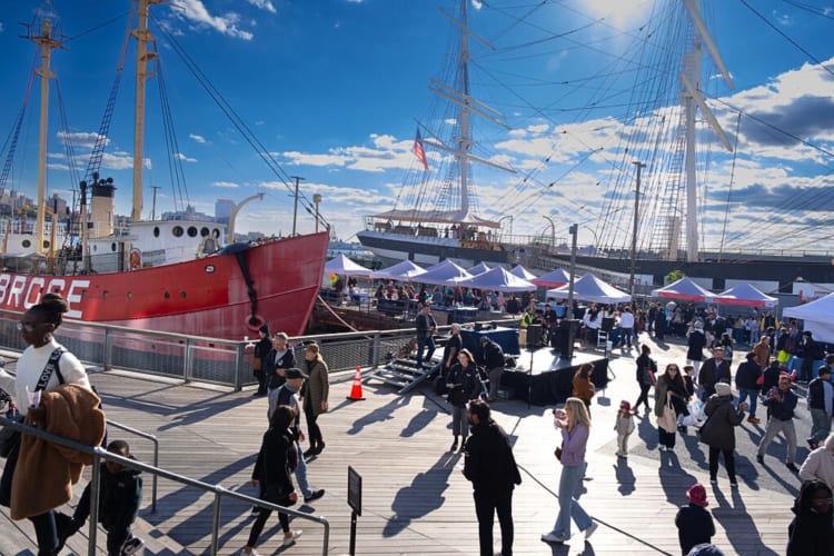 People walking around at Taste of the Seaport food festival in NYC