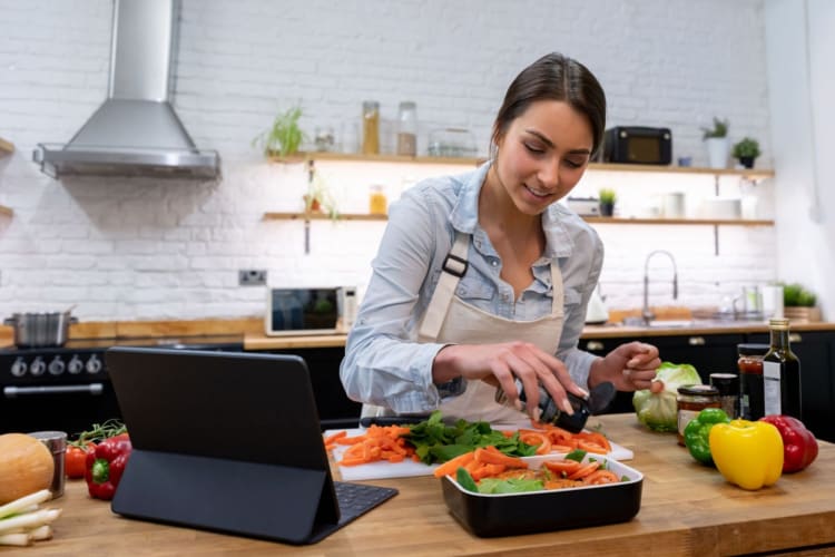 a bartender straining ingredients into a margarita on the rocks