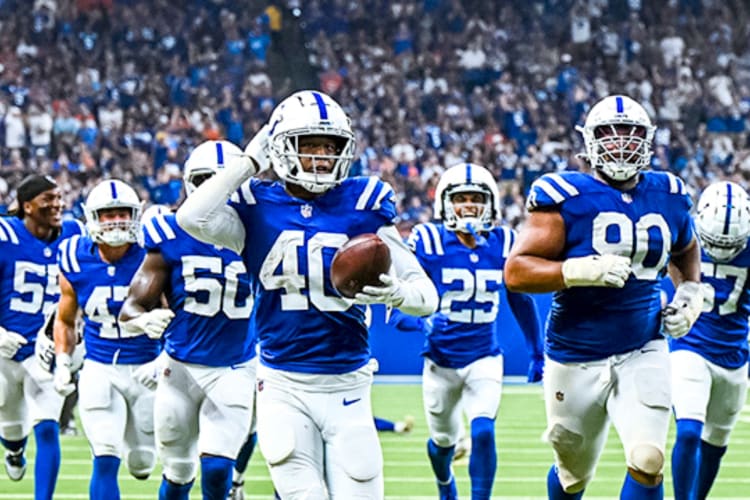 Football players in blue jerseys