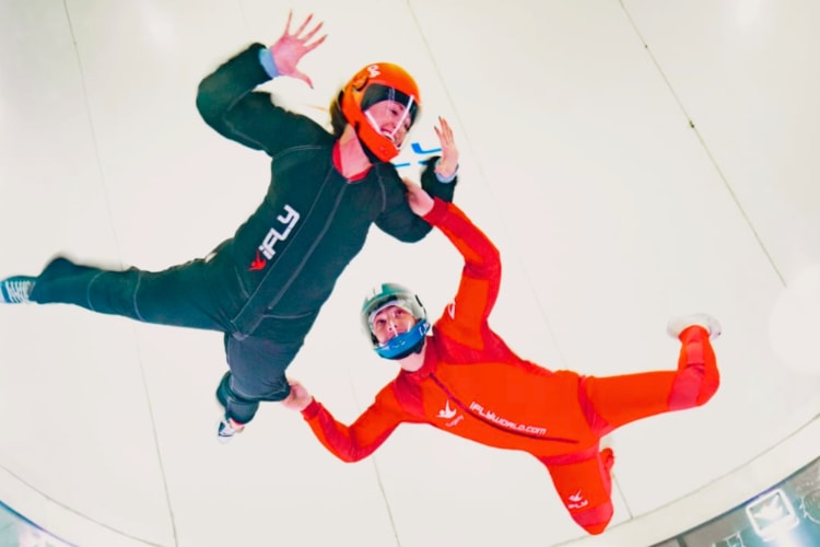 Two people indoor skydiving