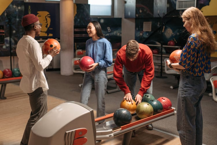 Four people at a bowling alley