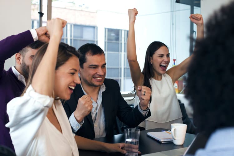 A happy team celebrating a success together.