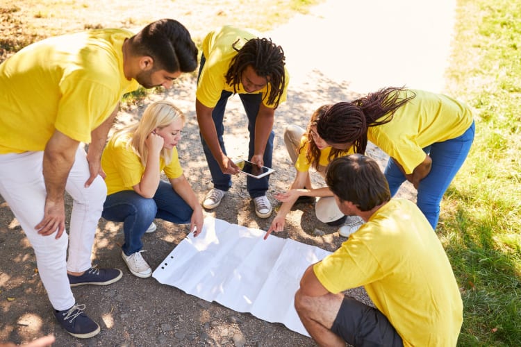A team engaging in a scavenger hunt, a great team building activity in Denver.