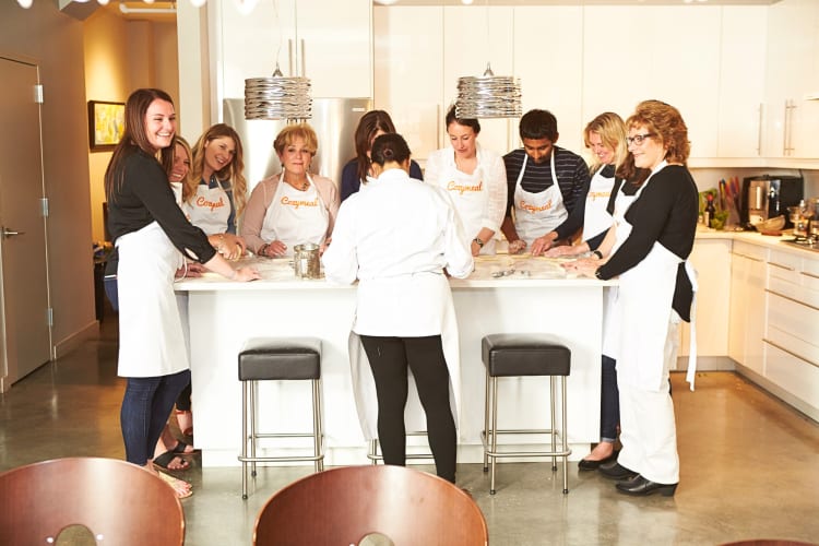 People taking a cooking class through Cozymeal as a team building activity in Los Angeles
