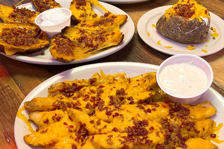 Various dishes with bacon bits and cheese