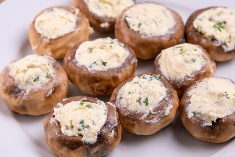 Mushrooms stuffed with herby cream cheese.