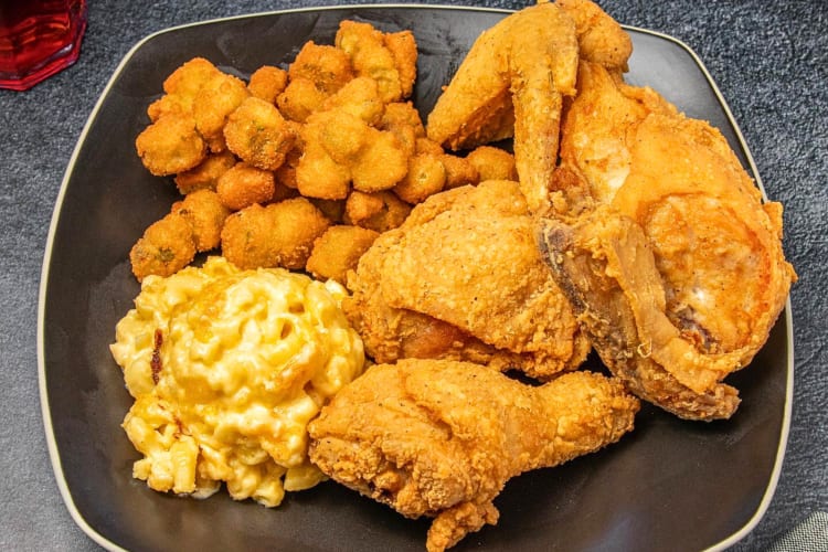 Fried chicken pieces, mac and cheese, and crumbed mushrooms from The Busy Bee Café