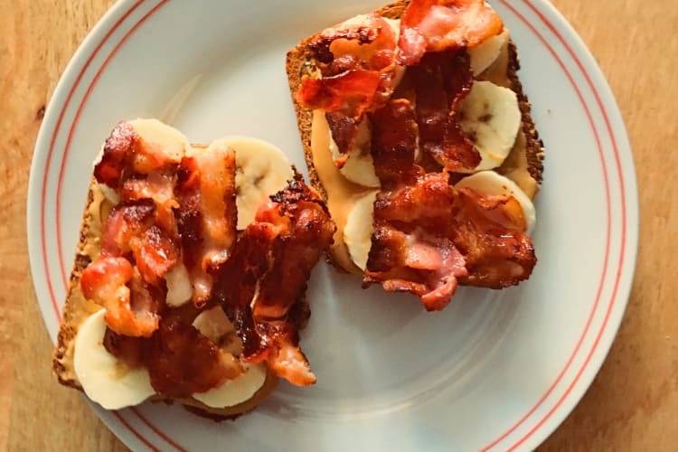 Peanut butter, banana and bacon on two slices of bread