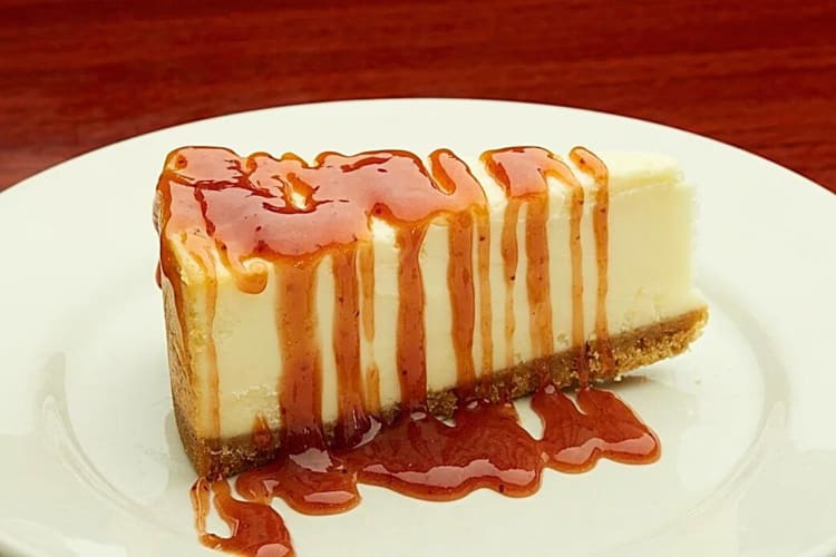Slice of guava cheesecake drizzled in syrup, from The Latin Grill, a Brandon restaurant