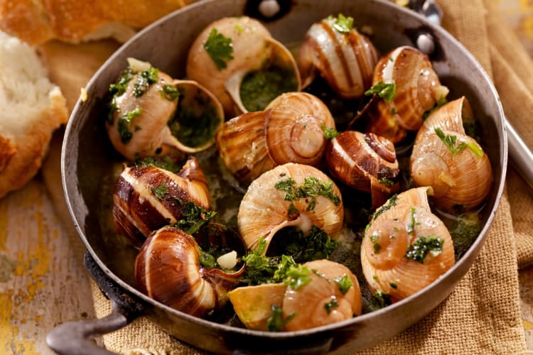 Escargots served in a pan at a seafood restaurant in Edmonton