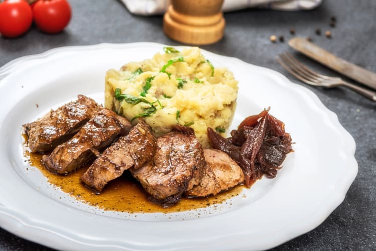 Grilled pork tenderloin with mashed potatoes and glazed onion