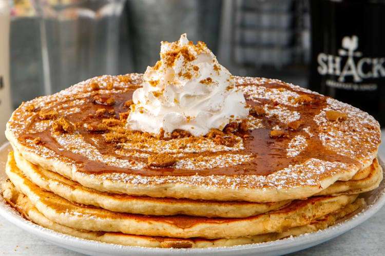 Pancakes with whipped cream and syrup on top from The Shack as a breakfast in St. Louis