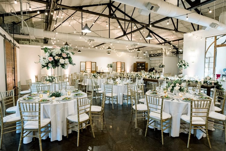 Tables, chairs and décor set up in a room at The Westside Warehouse, an event space in Atlanta 